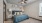 a bedroom with a bed and a fan