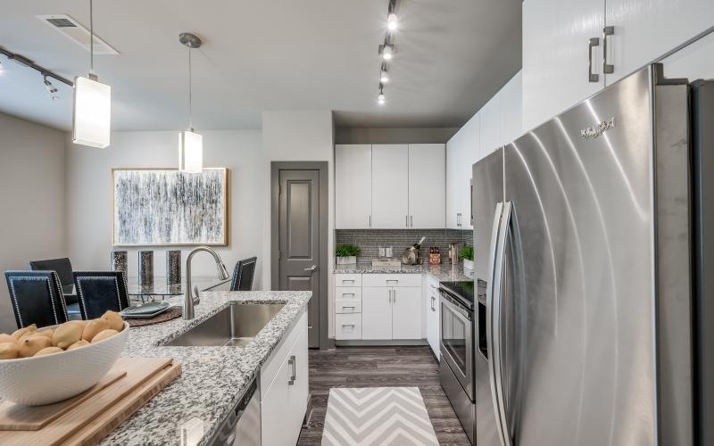 a kitchen with white cabinets