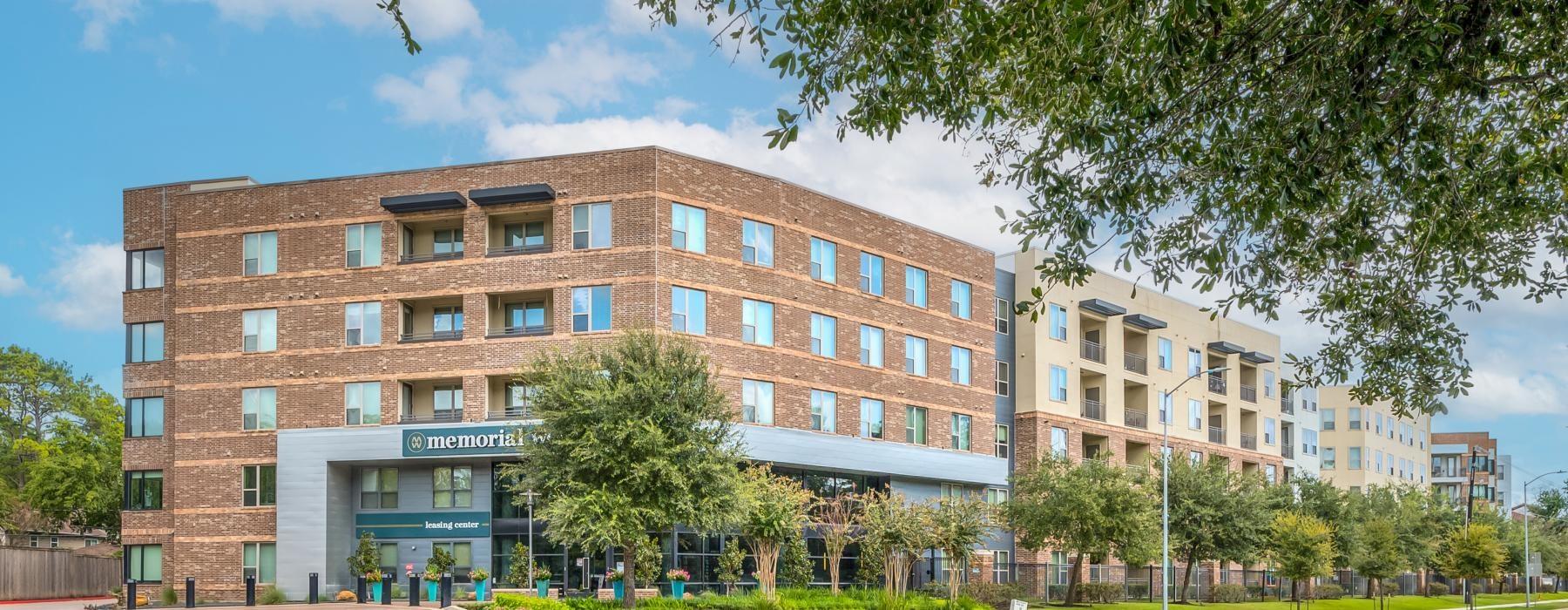 a large building with trees in front of it