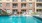 a swimming pool in front of a building