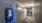 a hallway with a row of machines