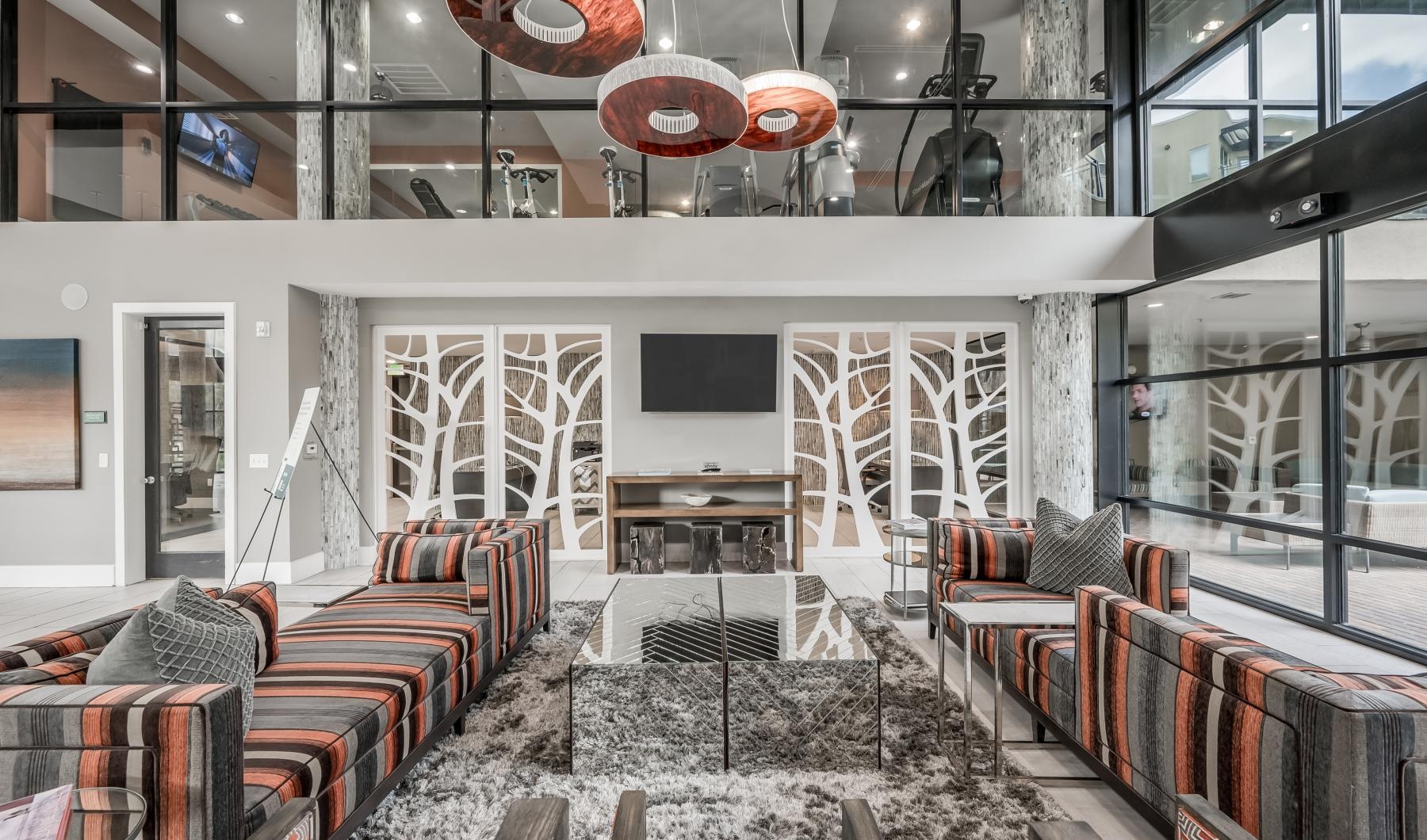 a room with a fireplace and chairs