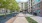 a brick walkway between buildings