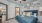 a bedroom with a bed and a fan